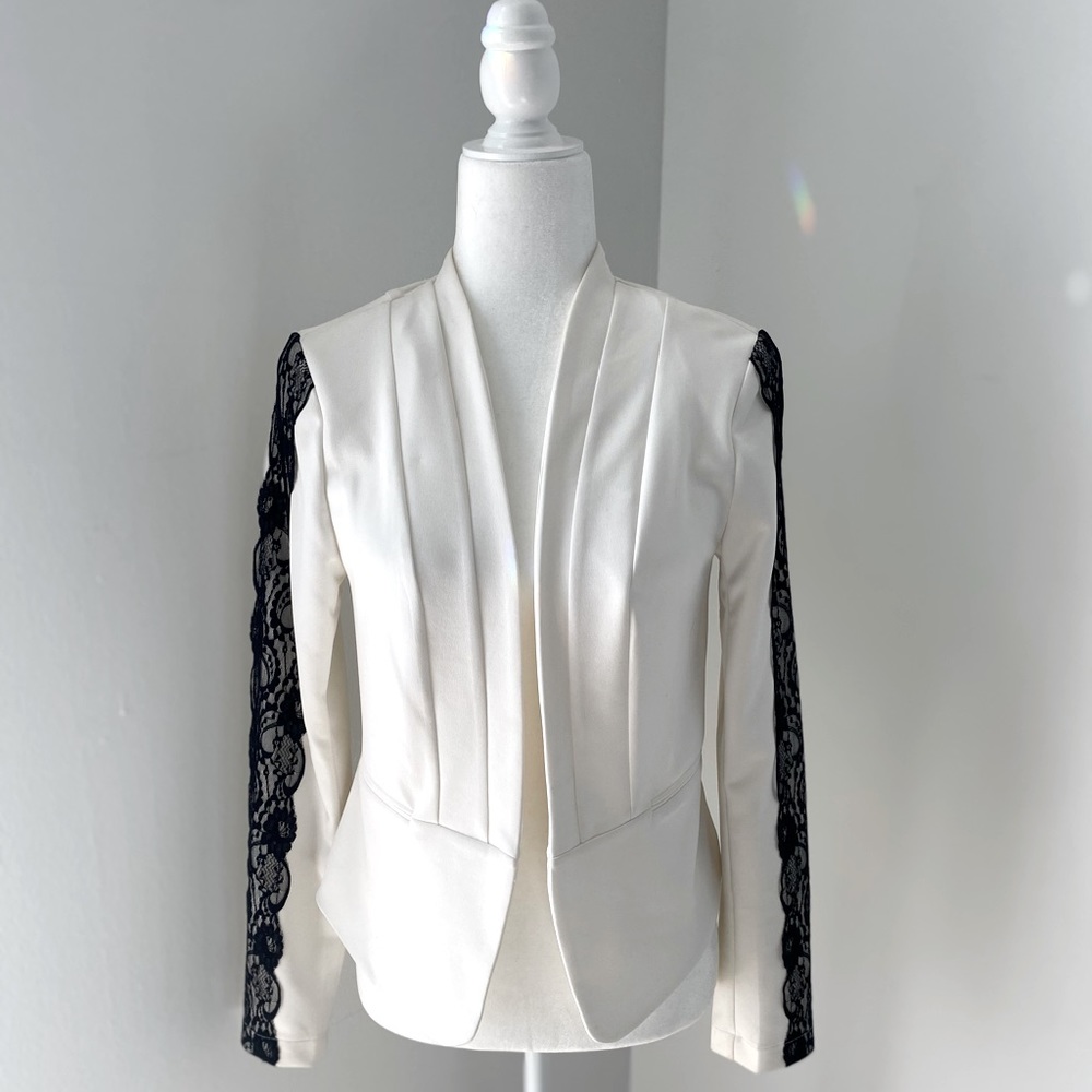 White Blazer with black lace trim on sleeves. ~ M